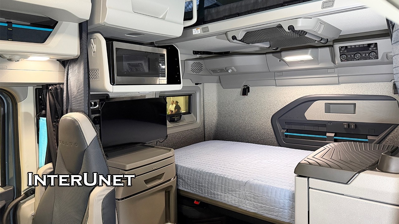 Spacious truck sleeper cabin with a bed, storage and a microwave